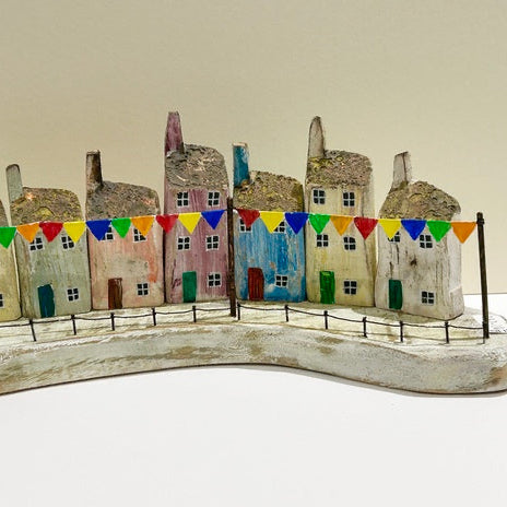 Seven Houses with Bunting. Woodcarving