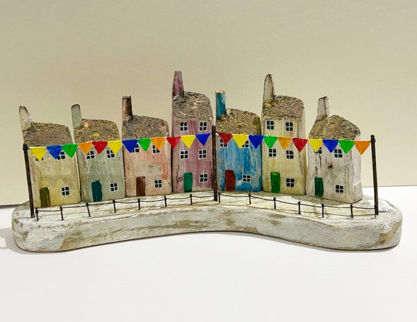 Seven Houses with Bunting. Woodcarving
